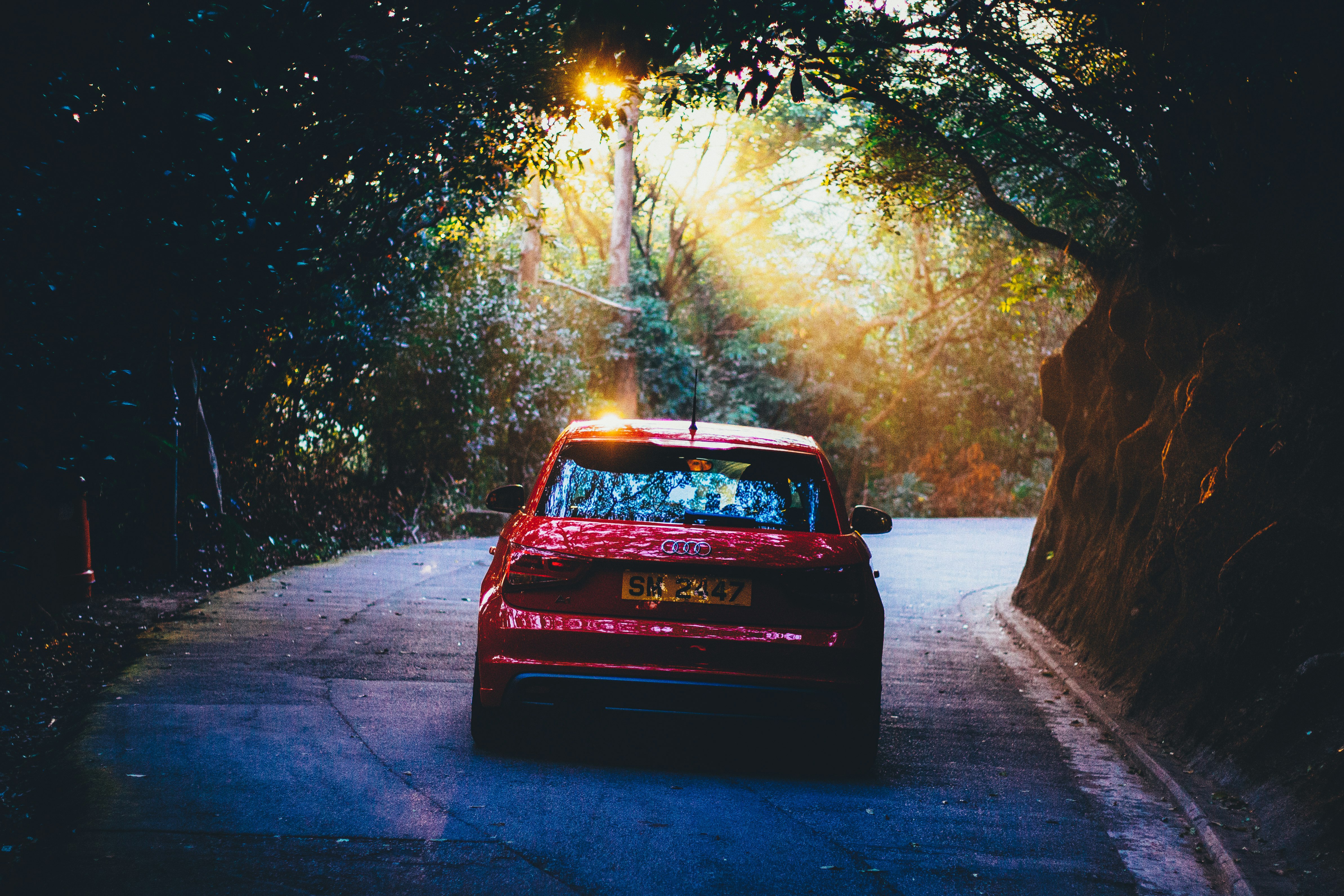 red vehicle on gray concrete